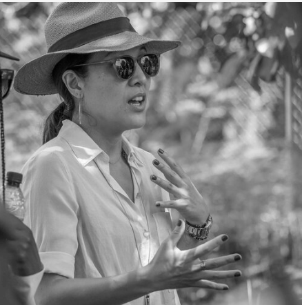 Ann Lee in a black and white photo in the field.