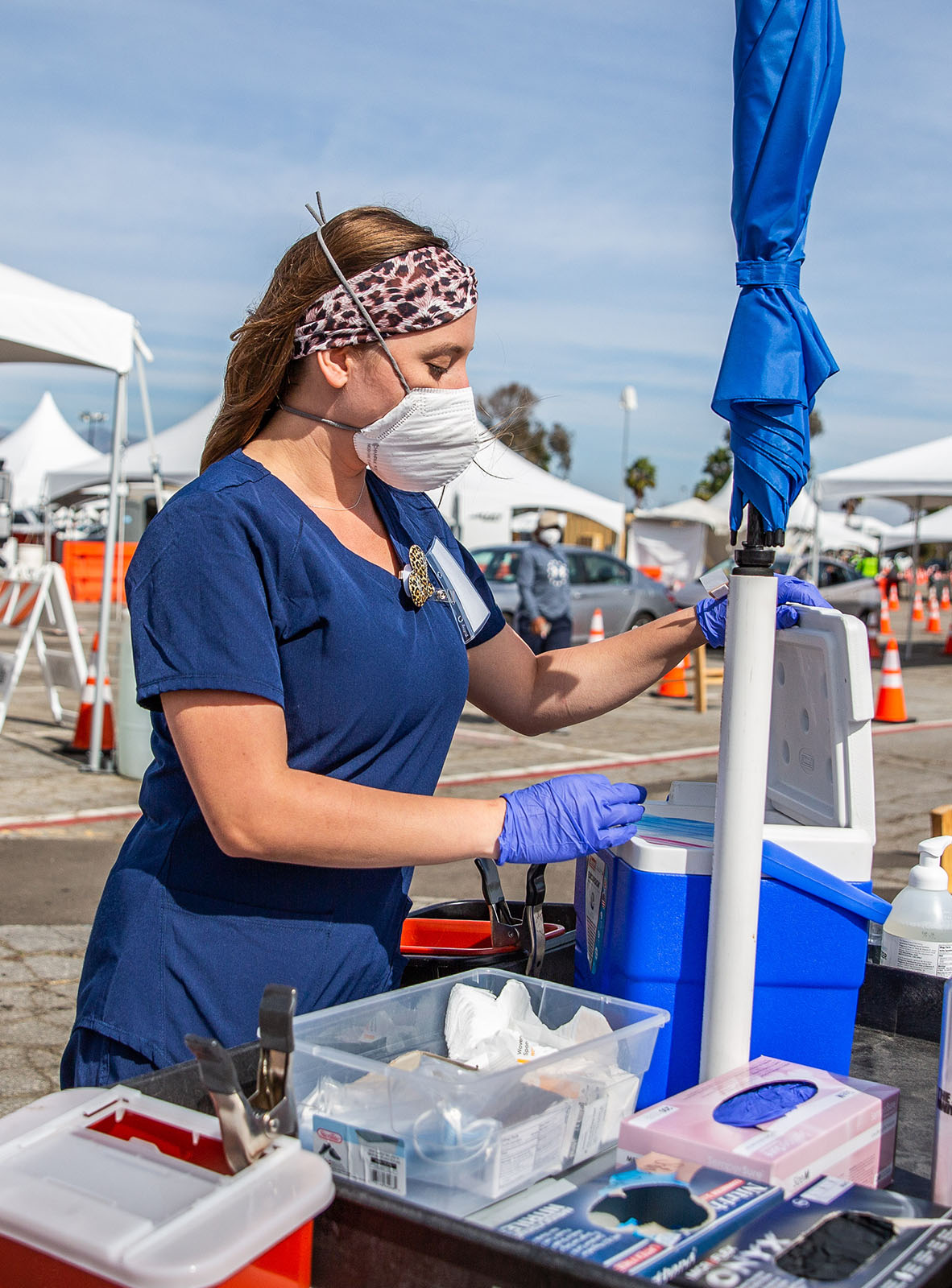 A volunteer working at a COVID 19 testing and vaccination site at Dodger Stadium in Los Angeles, CA.
