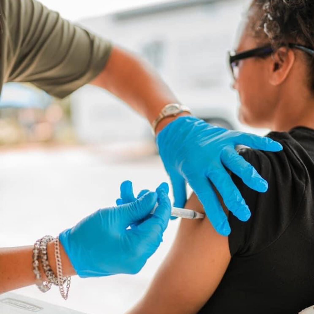 CORE Beneficiary receiving COVID-19 vaccine during the pandemic.