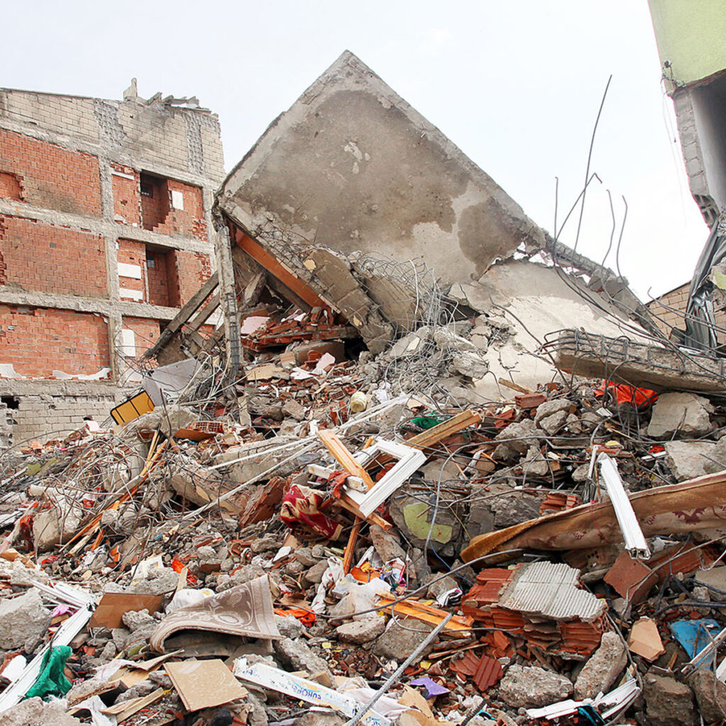 Massive piles of rubble from a building that was destroyed in the 2023 Turkiye earthquake/