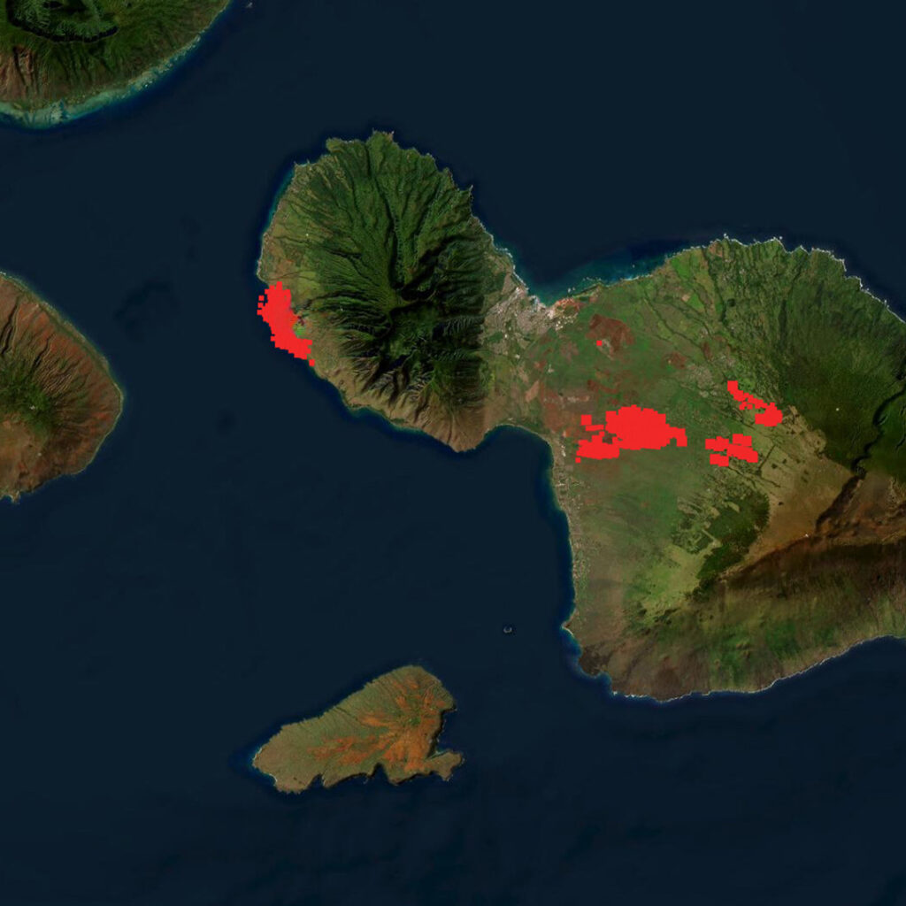 Satellite image of Maui with red highlights showing where the wildfires burned.