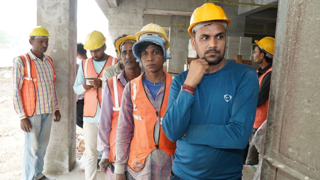 Construction workers wait in line at a distribution in the eastern Pune neighborhood of Wagholi, an area CORE had previously done COVID-19 vaccination work. On July 10, 2023, CORE distributed 250 food kits targeting migrant workers.