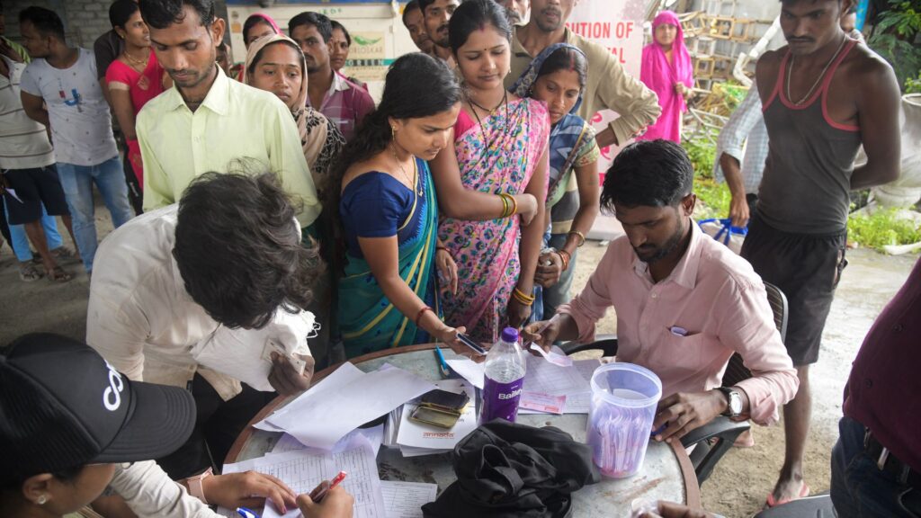 Registration during a distribution of 200 food kits to brick kiln workers in the Wagholi neighborhood of Pune on August 17, 2023.