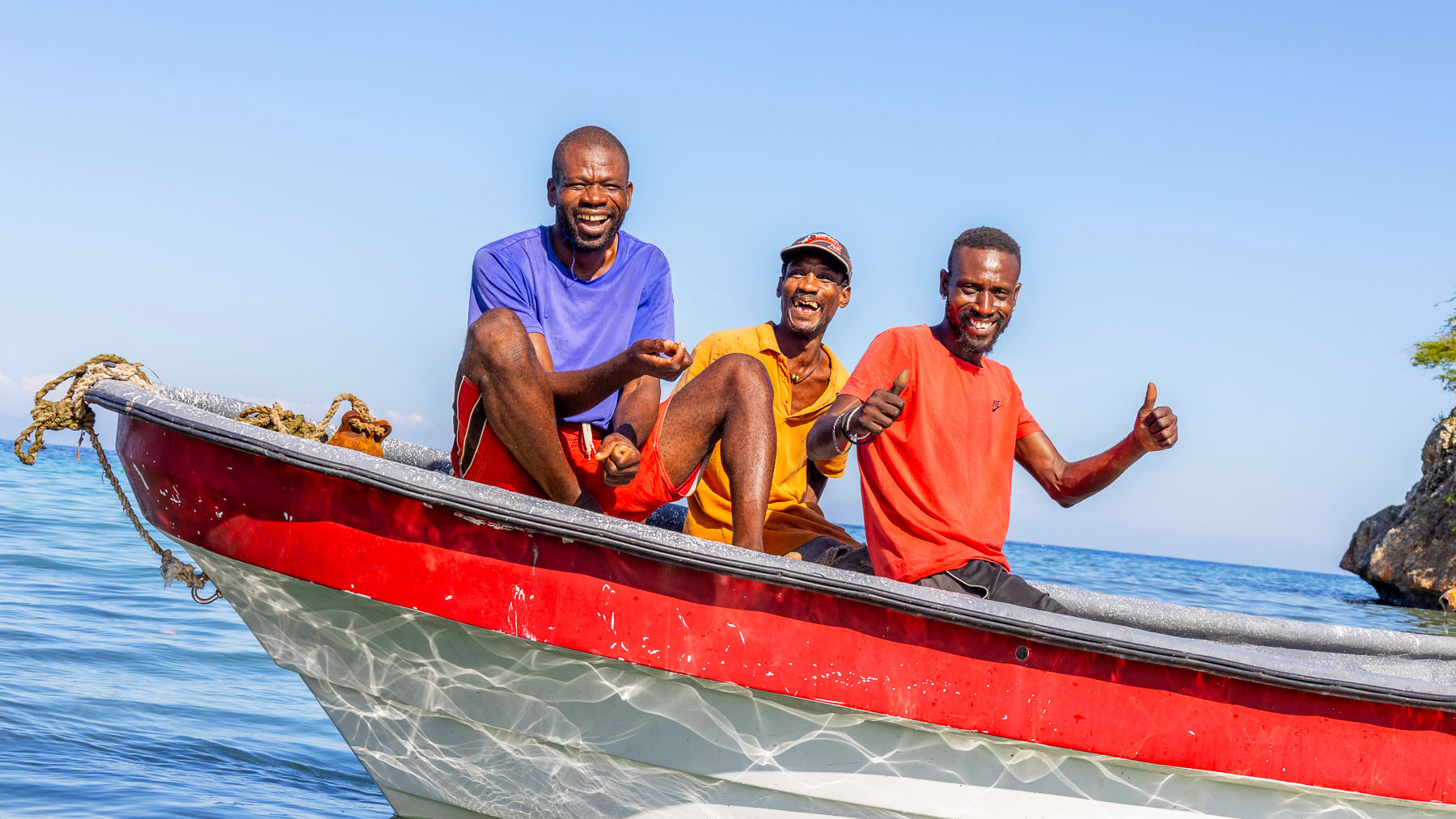 Fishermen sitting in a boat in southern Haiti.