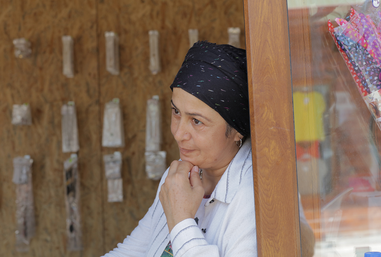 Nesrin sits inside her new shop in the Hassa district of Hatay in Turkey after the devastating earthquake on February 6, 2023.