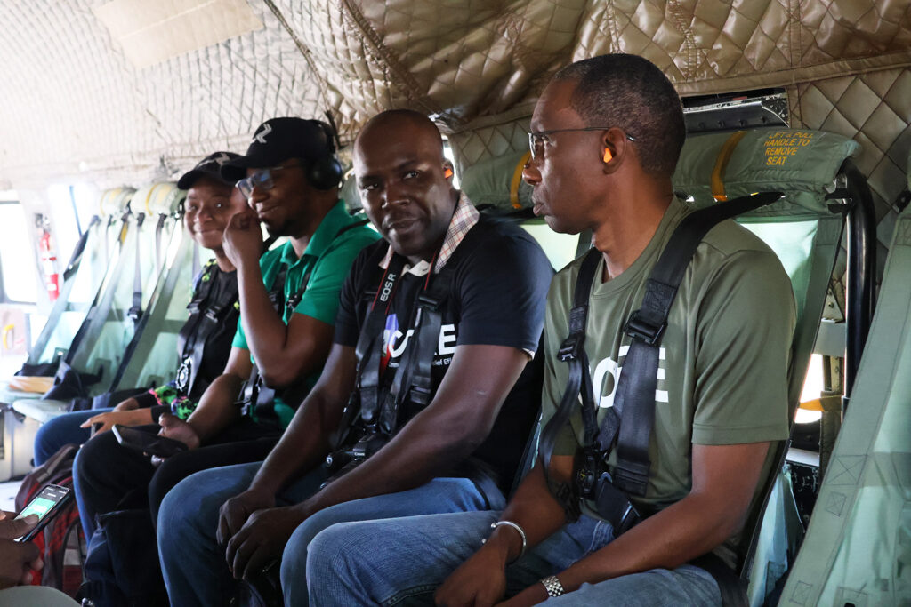 Garry, a Haiti staff member sits in helicopter in Haiti