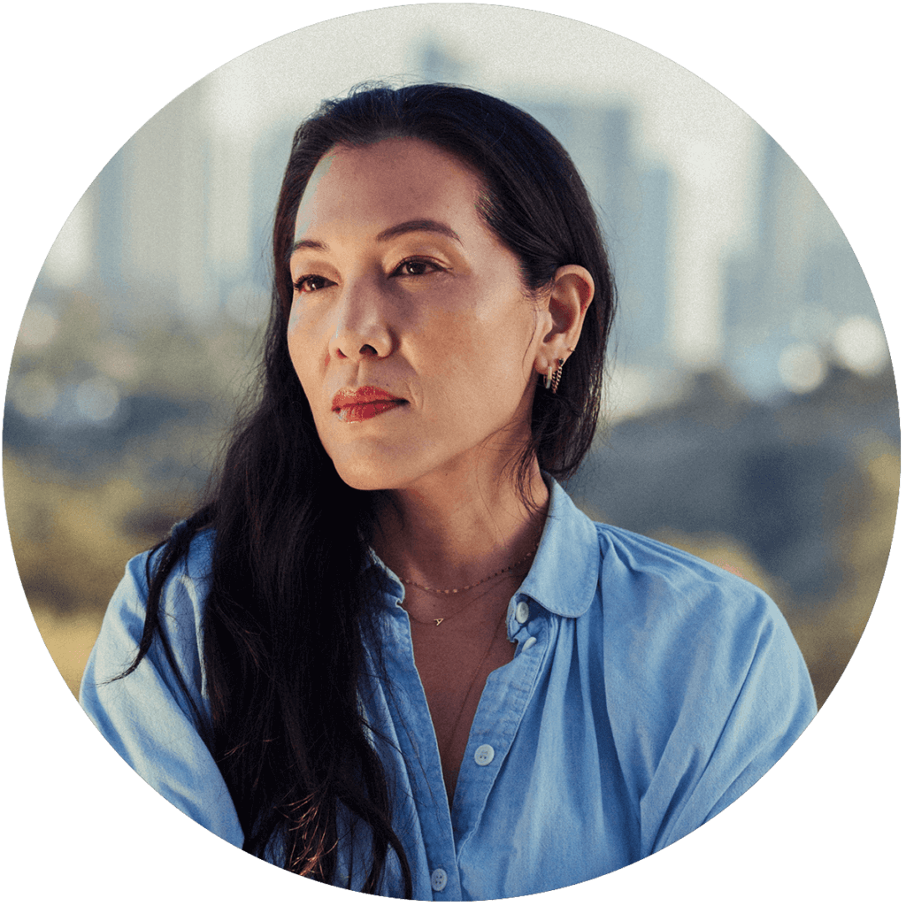 Portrait photo of CORE CEO, Ann Lee in front of downtown LA skyline.