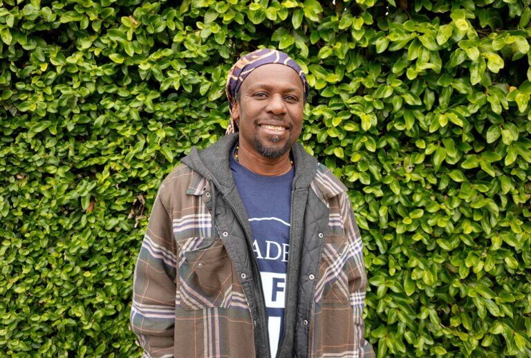 Alphonse, a beneficiary of CORE's 5-Year Community Recovery Plan, poses for a photo in Altadena.