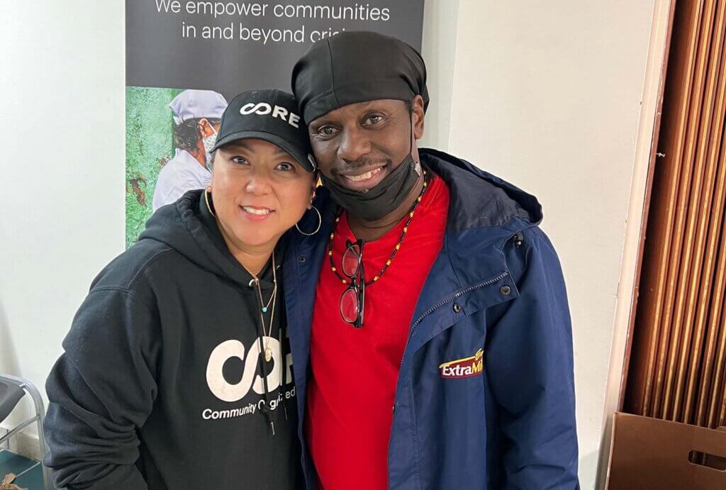 Alphonso, a benficiary of CORE's 5-Year Community Recovery Plan and Sunny, a member of CORE, stand together and pose for a photo.