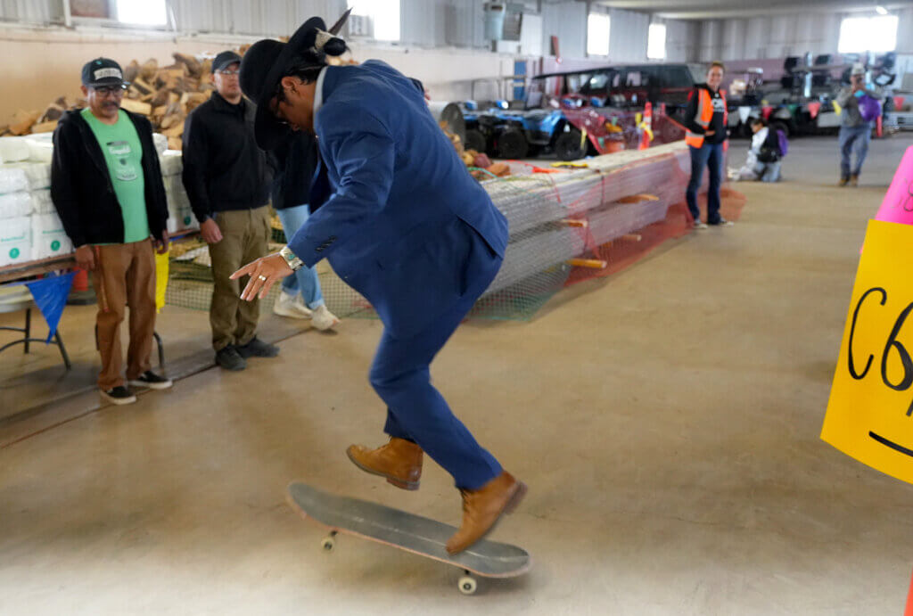 Navajo Nation President, Buu Nygren doing skate tricks at the resource distribution.