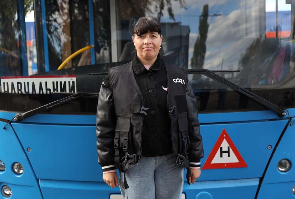 Tram driving student, Victoria, poses for a photo in from a tram.
