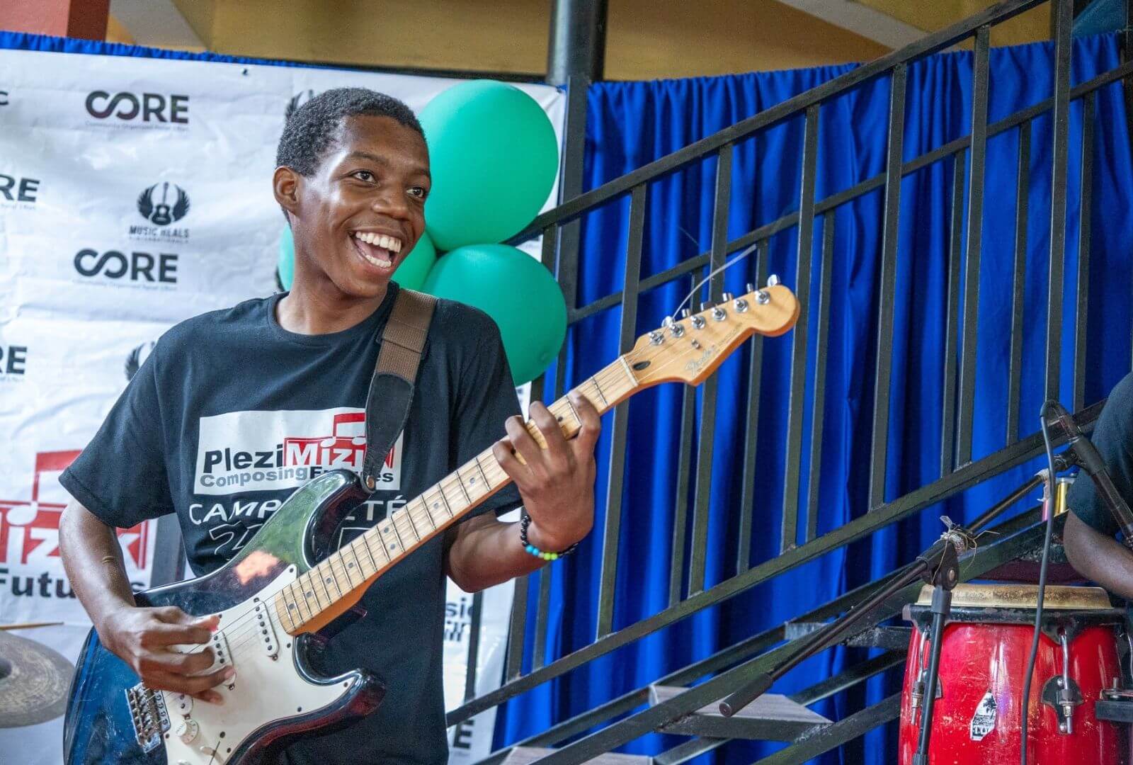 3 - haitian boy plays guitar