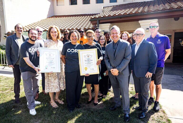 Mayor Bass poses with the CORE team and representatives from our partners.