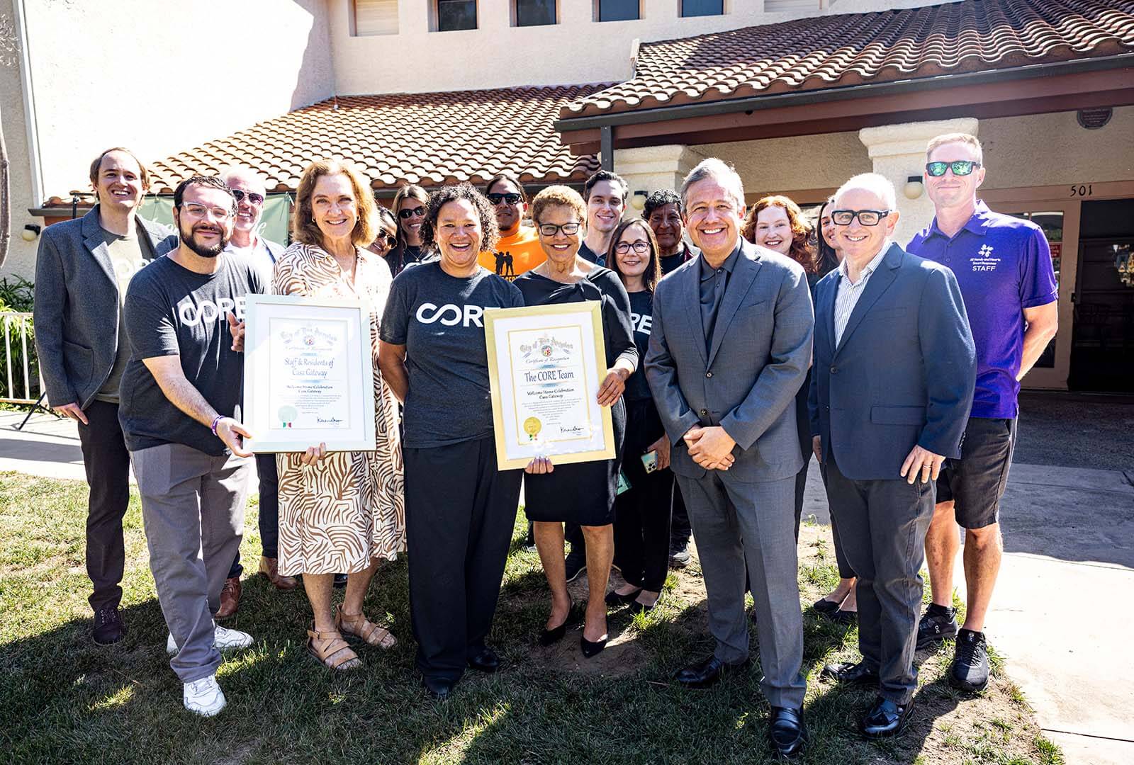 Mayor Bass poses with the CORE team and representatives from our partners.