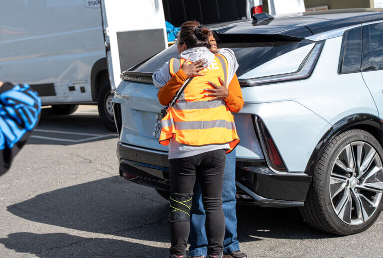 A CORE staff member hugging an Altadena community member.