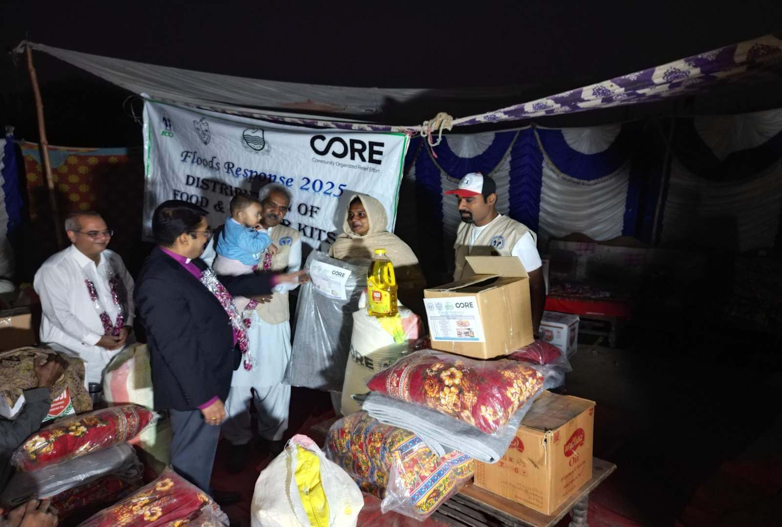 A family receives a winter kit full of supplies