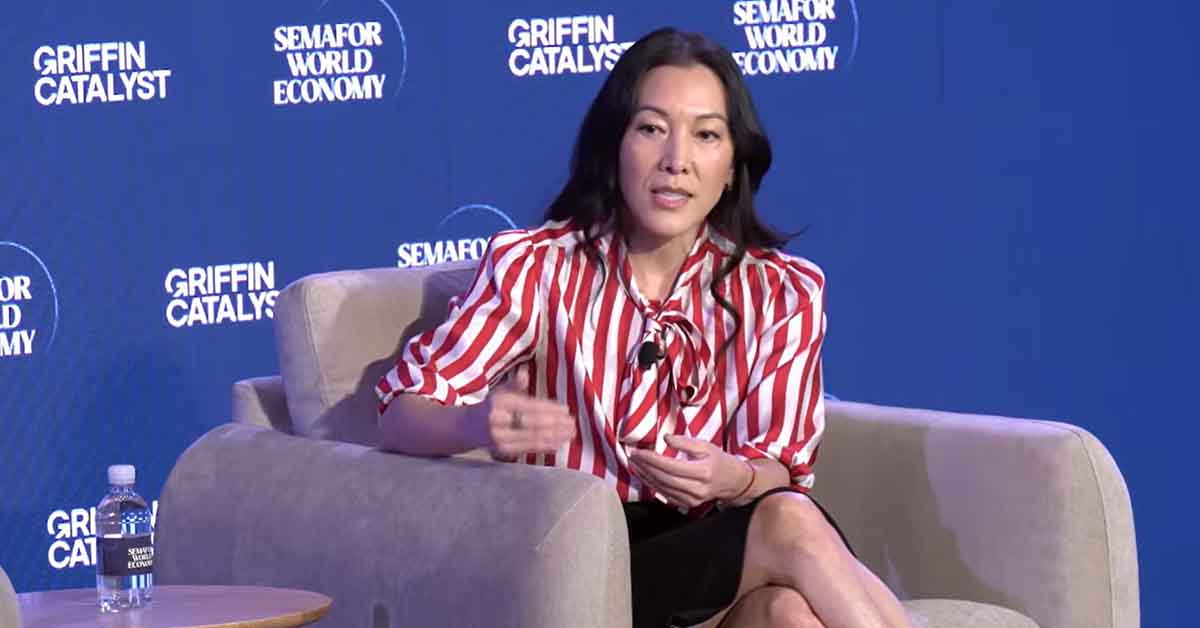 CEO Ann Lee sitting and speaking on the stage at the Semafor conference.