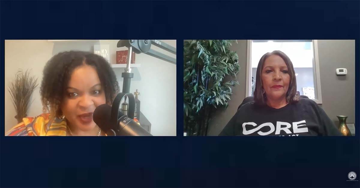 A screen grab from a video of a podcast of two people talking on camera.