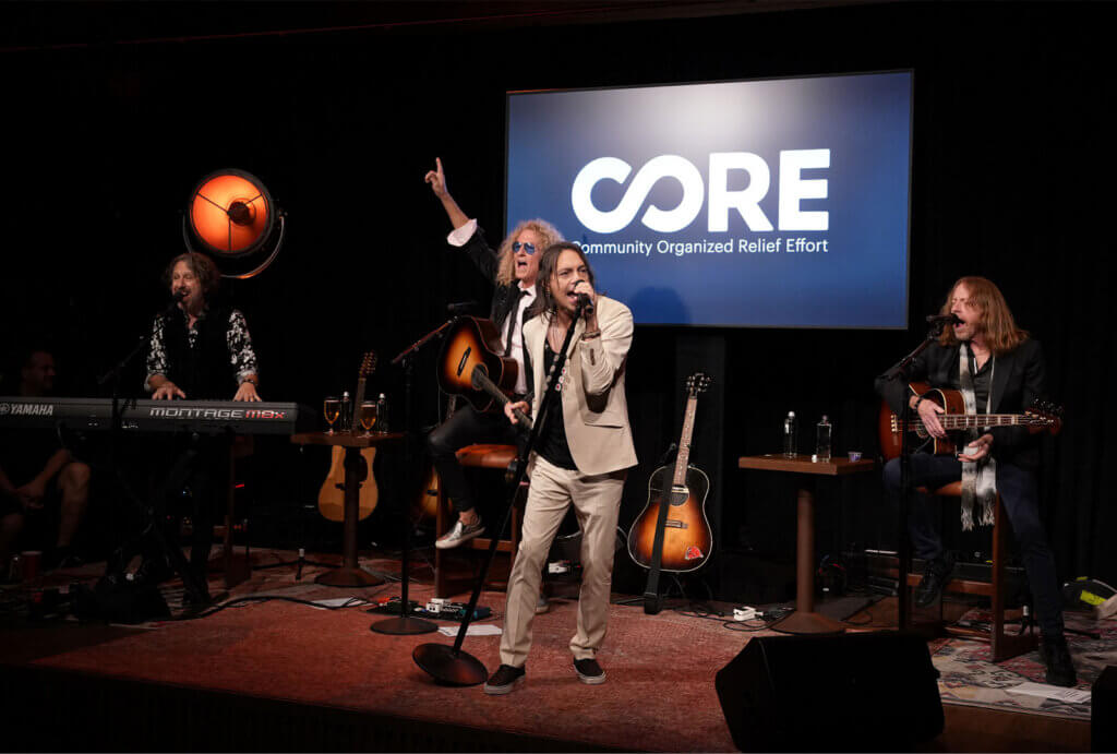 Rockband Foreigner performing on stage at CORE's 2026 Los Angeles Afterflow event.