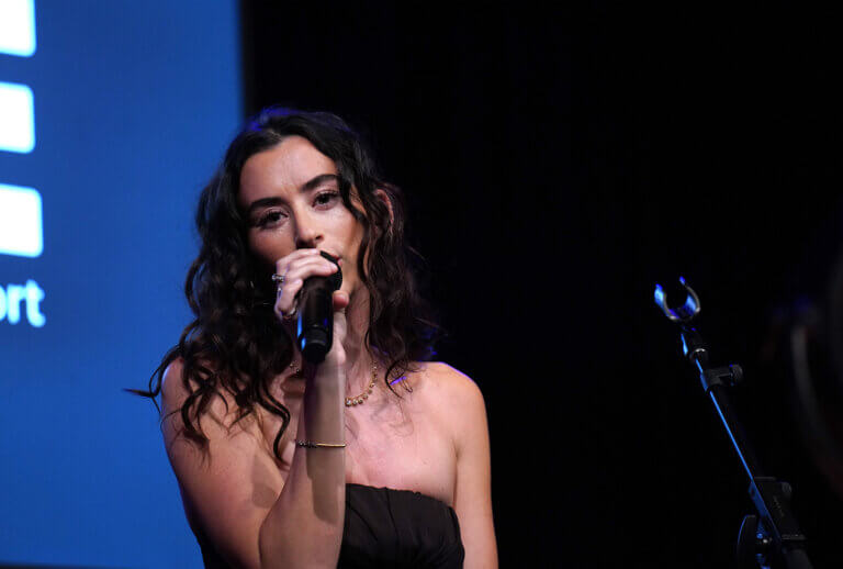 Stella Lefty performing on stage at CORE's Afterglow event in Los Angeles